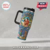 Elvis Presley Blue Hawaii 65th Anniversary 40oz tumbler with tropical floral pattern, hula dancer, and movie scene imagery.