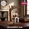 Elvis Presley Can't Help Falling In Love Wooden Swing Figure featuring Elvis in a white jumpsuit sitting on a tree swing.