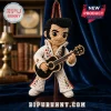 Elvis Presley Hand-Crochet Car Hanging Ornament wearing a white jumpsuit and holding a black guitar against blue fabric.