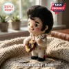Elvis Presley Handmade Felt Pocket Hug wearing a white jumpsuit with sequins and holding a small brown felt acoustic guitar.