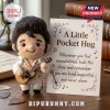 Elvis Presley Handmade Felt Pocket Hug figurine wearing a white jumpsuit with a tiny guitar next to an encouraging card.