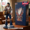 Elvis Presley Jeweled Performance Edition Vinyl Figure in a blue jumpsuit with red and gold beadwork holding a guitar.