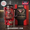 Essendon Bombers 154th Anniversary Stanley Tumbler featuring red and black flame graphics and team logo on a metal cup.