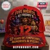Five Nights at Freddys 12th Anniversary Baseball Cap in red featuring Freddy, Bonnie, and Chica with a large number 12 logo.