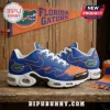 Florida Gators Nike Air Max running shoes featuring blue and orange team colors on a rustic wooden table background.