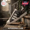 Ghostface Scream Horror Movie Casual Sneakers featuring black artwork on a cream canvas shoe sitting on wooden stairs.