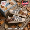 Gilmore Girls Luke’s Diner Casual Sneakers with coffee mug and book stack graphics on a wood surface with fall leaves.