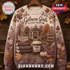 Gilmore Girls Stars Hollow Autumn Ugly Sweater featuring a gazebo, books, and fall foliage on a cream and purple gradient.