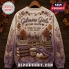 Gilmore Girls Stars Hollow Autumn Ugly Sweater featuring a gazebo, town landmarks, coffee, books, and fall foliage design.
