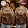 Gilmore Girls Stars Hollow Autumn Ugly Sweater featuring fall foliage, gazebo, books, and coffee cup graphics on beige knit.