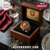 Gold Leo Zodiac Signet Ring with a lion head emblem on a deep red background inside a dark wooden display box.