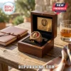 Gold Leo Zodiac Signet Ring featuring a lion head crest with red background in a wooden presentation box on a table.
