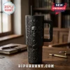 Gothic Skull Snake Black Stanley Tumbler 40oz featuring an engraved occult pattern with moon phases on a wooden desk.