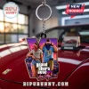 Grand Theft Auto VI Vice City keychain featuring a purple Roman numeral V frame with two characters on a metal ring.