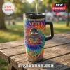 Grateful Dead 1965-2026 Anniversary YETI Tumbler Cup featuring tie-dye patterns, skull logo, and guitar on a wooden table.