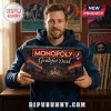 Grateful Dead Collector Monopoly Board Game box held by a man wearing a blue hoodie in a music-themed room.