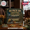 Green Bay Packers 24-Day Christmas Advent Calendar box with football stadium art, helmet, and ornaments on a wooden desk.