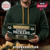Green Bay Packers Collector Monopoly Board Game box held by a man wearing a dark green hooded sweatshirt.