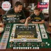 Green Bay Packers Collector Monopoly Board Game featuring branded game board, play money, and metallic player tokens.