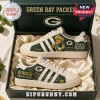 Green Bay Packers Heritage Mascot Casual Shoes in cream and green with cheesehead mascot and stadium graphics in a gift box.