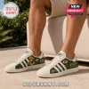 Green Bay Packers Heritage Mascot Casual Shoes featuring a cheesehead mascot, football field art, and team logo on white.