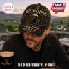 Guinness 267 Years St. James Gate baseball cap in black with gold embroidery and graphic print on a man wearing a jacket.