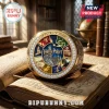 Harry Potter 25th Anniversary Gold Engraved Ring featuring house emblems and blue enamel center on an open antique book.
