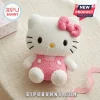 Hello Kitty Soft Plush Doll featuring white fur, pink bow, and pink overalls on a neutral linen background.