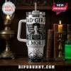 Hocus Pocus Sanderson Sisters 40oz Tumbler with mugshot graphics, white handle, and a straw on a dark wooden shelf background.