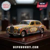 Hot Wheels John Lennon 85th Anniversary Rolls-Royce Car featuring yellow paint with psychedelic multi-colored flower patterns.
