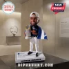 Houston Astros Yordan Alvarez resin bobblehead figure wearing a white cap and holding a silver trophy on a display base.