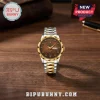 Indian Motorcycle 125th Anniversary Watch featuring a brown textured dial, gold-tone bezel, and two-tone steel link band.