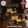 Indianapolis 500 1911 Marmon Wasp No. 32 collector brick set with a yellow racing car, race driver figure, and display stand.