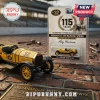 Indianapolis 500 Marmon Wasp No. 32 diecast car toy sitting on brick track next to commemorative blister pack packaging.