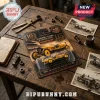 Indianapolis 500 Marmon Wasp No. 32 diecast car toy in packaging on a wooden desk with vintage racing photos and tools.