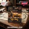 Indianapolis 500 Marmon Wasp No. 32 diecast car toy in black and gold blister packaging on a vintage wooden desk.
