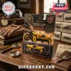 Indianapolis 500 Marmon Wasp No. 32 diecast car toy in yellow packaging with 115th anniversary branding on a wooden desk.