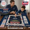 Indianapolis Colts Monopoly Collector Board Game played by a father and son with blue branded game pieces and accessories.