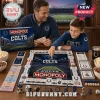 Indianapolis Colts Monopoly Collector Edition board game being played by a father and son at a wooden table.