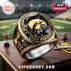 Iowa Hawkeyes 2025 Championship Commemorative Ring featuring a black gemstone, gold logo, and inscribed side details.