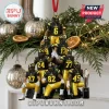 Iowa Hawkeyes 2026 Football Team Christmas ornament featuring a pyramid of seven player figurines in black and yellow kits.
