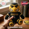 Iowa Hawkeyes Heroes Game Champions plush toy featuring a black and yellow crocheted bird figure with team logo on feet.