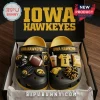 Iowa Hawkeyes NCAA Team Mascot Clogs With Charms in black and yellow, featuring football-themed accessories in a box.