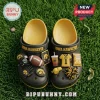 Iowa Hawkeyes NCAA Team Mascot Clogs With Charms featuring team logos, a football, jersey, and whistle on black foam shoes.