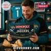 Jacksonville Jaguars NFL Collector Board Game box held by a man wearing a teal and black team hoodie in a sports room.