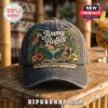Jimmy Buffett Premium Charcoal Baseball Cap featuring tropical parrot, acoustic guitar, margarita, and beach scene embroidery.
