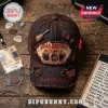 Jonas Brothers Burning Up Tour distressed baseball cap in brown with embroidered patches, pins, and ripped fabric details.