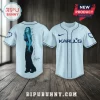 Karol G Album Signature Light Blue Baseball Jersey showing a photo graphic on the back and brand logo on the front.