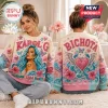 Karol G Mañana Sera Bonito ugly sweater featuring blue hair portrait on front and Bichota wings text on back, pastel knit.