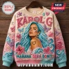 Karol G Mañana Sera Bonito ugly sweater featuring blue hair portrait, embroidered butterflies, hearts, and hibiscus flowers.